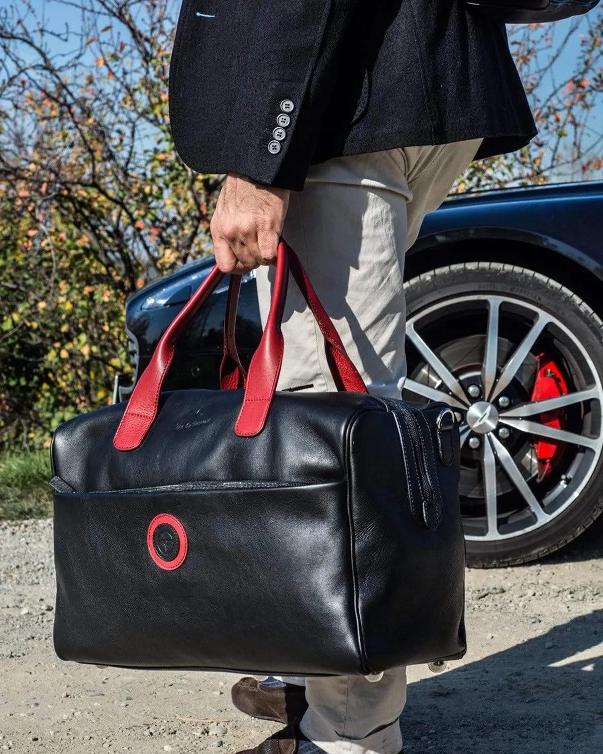 GLOBETROTTER - Full-grain Leather Duffle Bag - Black/Red